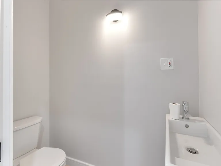 Powder room is compact, but functional.