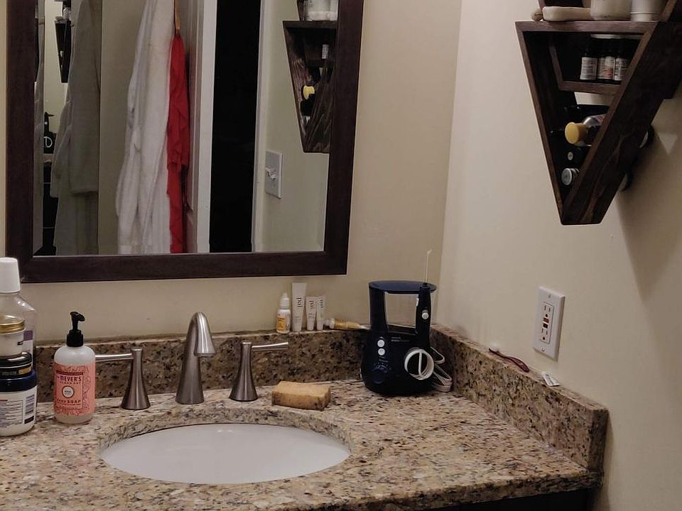 bathroom with updated cabinetry