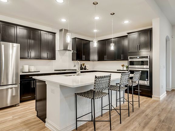 Gorgeous pendant and recessed lighting at kitchen