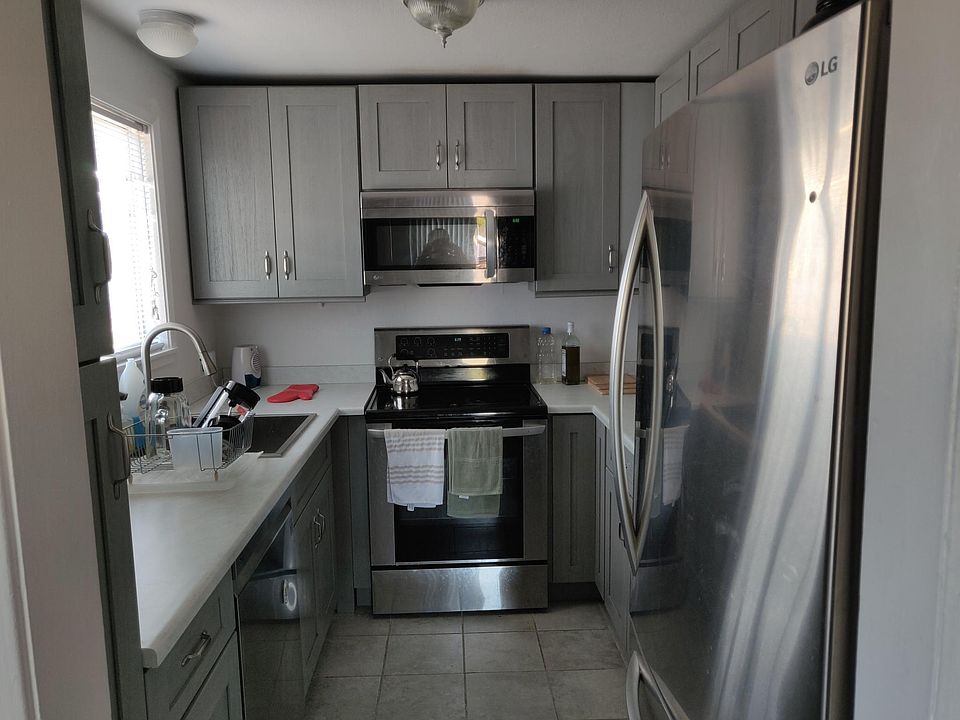 Recently remodeled kitchen with large fridge, dishwasher, built in microwave and stove. Includes floor to ceiling pantry.