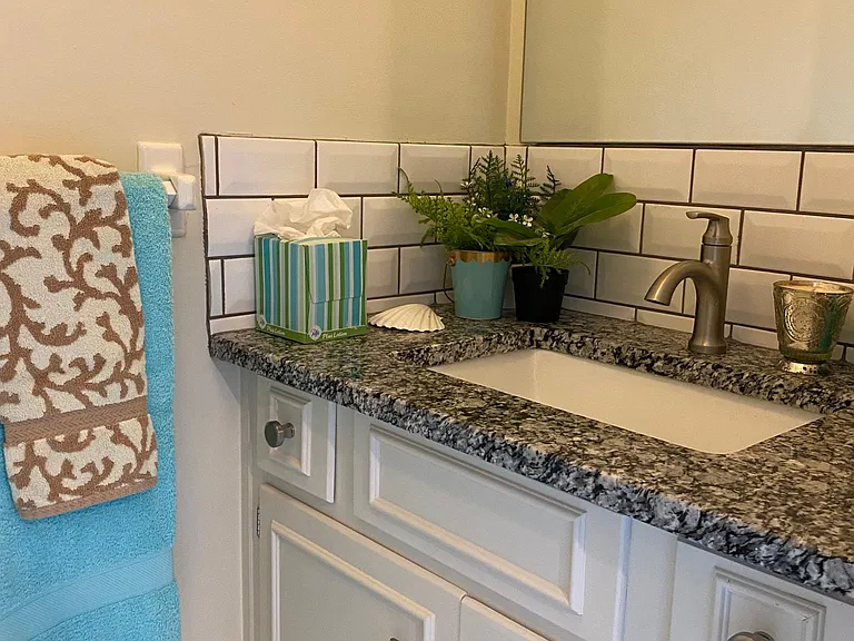 Half bath in lower level, next to family room