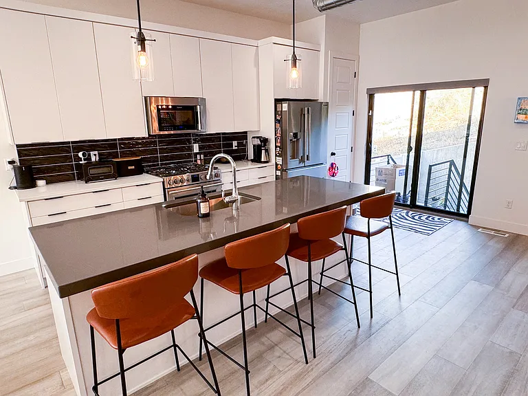 2nd floor kitchen with island and enough seating for 4.