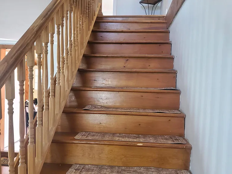 Stairway to upstairs bedrooms and bathrooms.