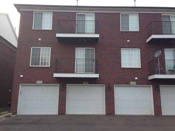 Rear of Condo / 1 Car Garage
