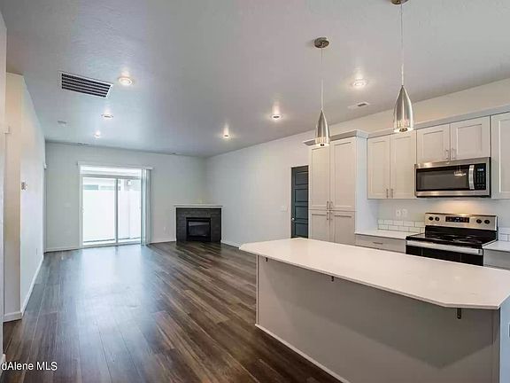 Kitchen, dining, living with gas fireplace