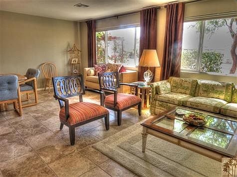 another view of the front living room showing the lovely tile floors