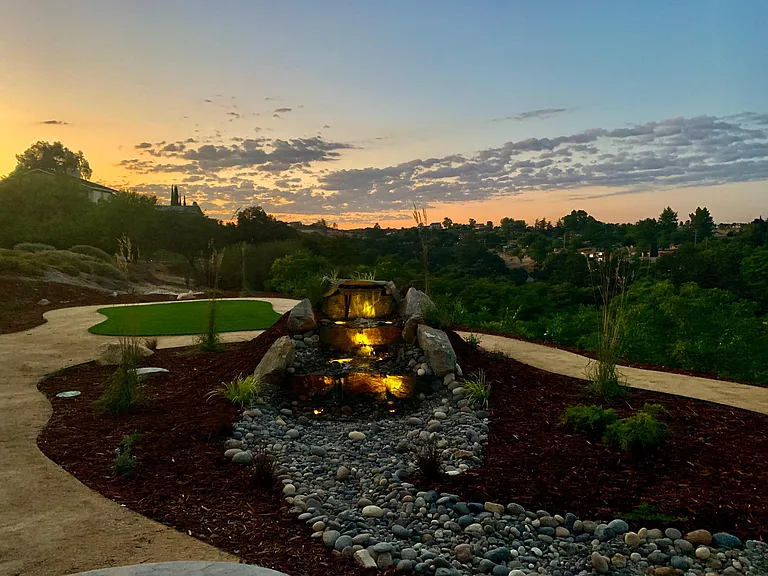 Lights on waterfall at sunset
