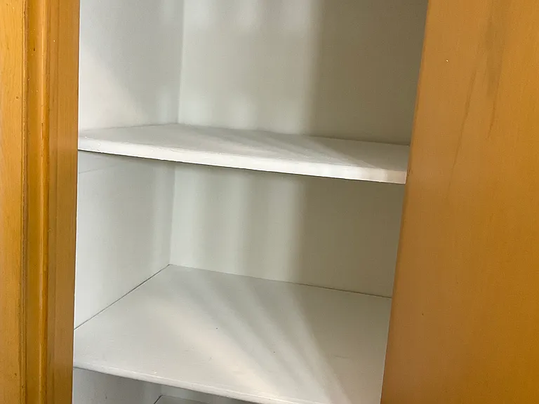 Linen closet in bathroom, with built in shelves