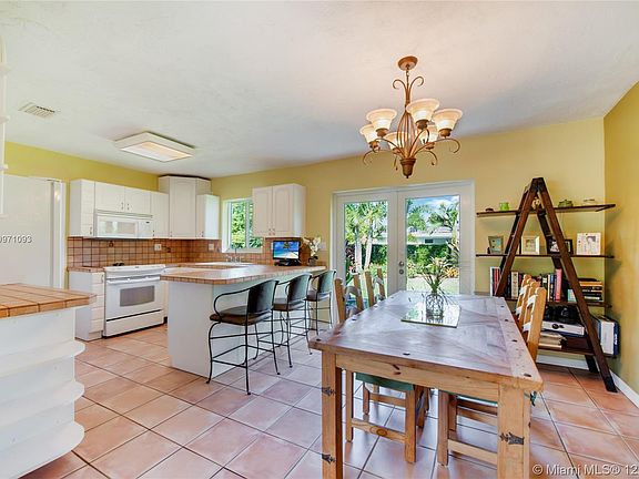 Kitchen opens to large backyard. 