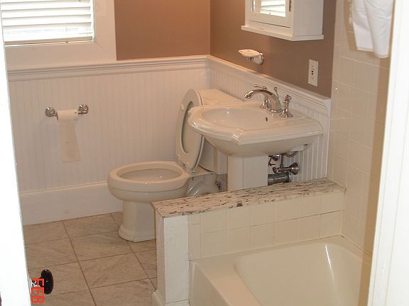 UPDATED BATHROOM WITH TILE FLOORS