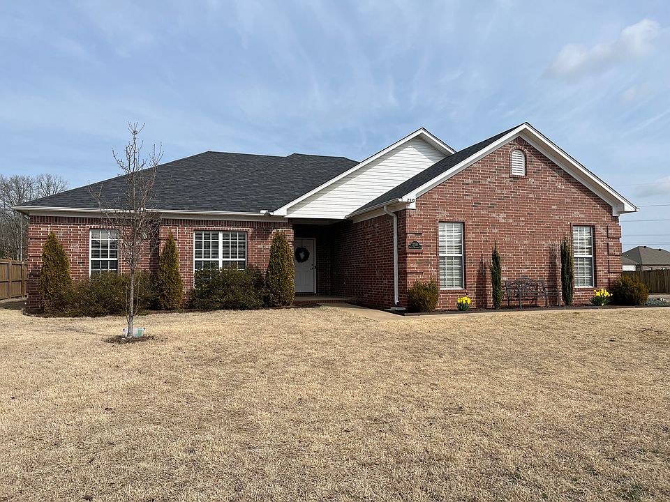 Brick house with large corner lot