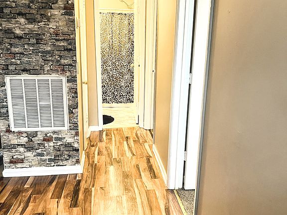Hall to bedrooms and bathroom .
