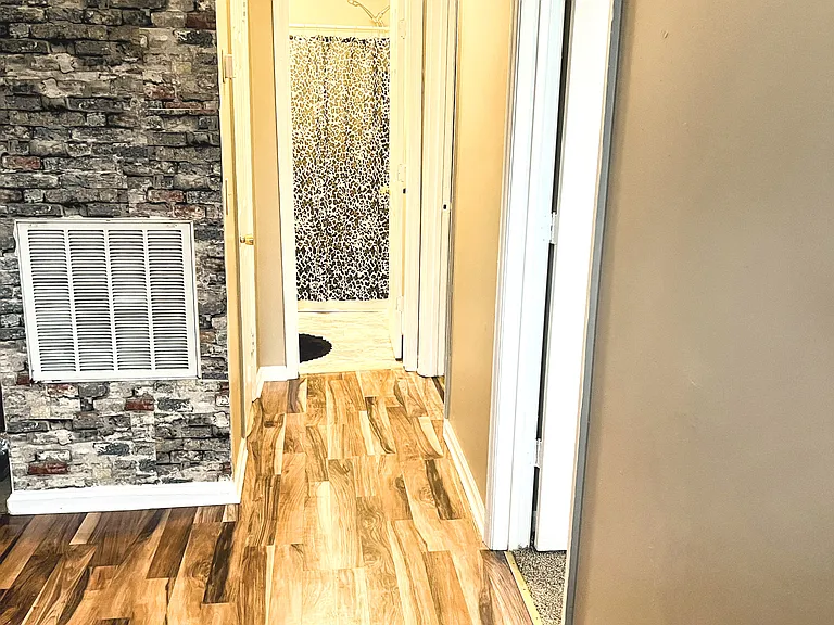 Hall to bedrooms and bathroom .