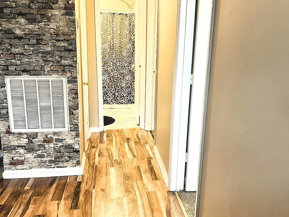 Hall to bedrooms and bathroom .