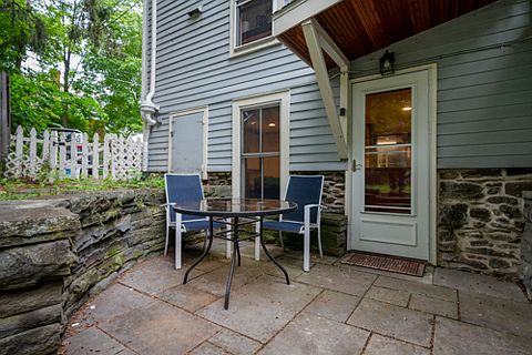 rear patio and west entrance to the apartment