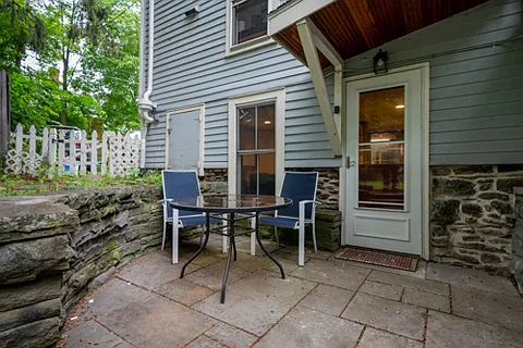 rear patio and west entrance to the apartment