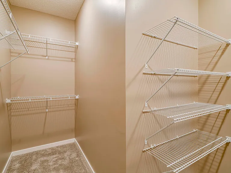 Large walk-in closets offer plenty of space to keep your wardrobe organized and store your clothing and more.