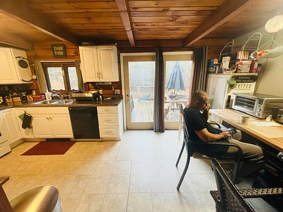 kitchen that leads to back porch fro grilling and area for patio and back yard.