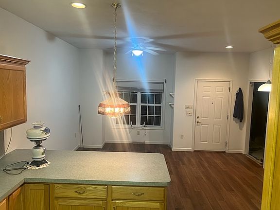 Image is from Kitchen, looking at front door into the dining room - dinette.
New LVP vinyl plank flooring troughout