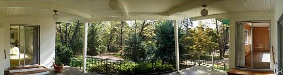 View from living room sliding glass door looking over patio to p