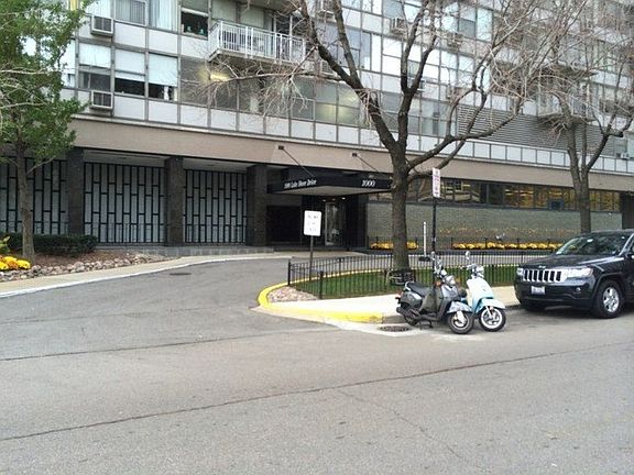 THE CIRCULAR DRIVEWAY APPROACHES THE BUILDING AT THE CORNER OF LAKE SHORE AND BELLEVUE. WALK TO THE 