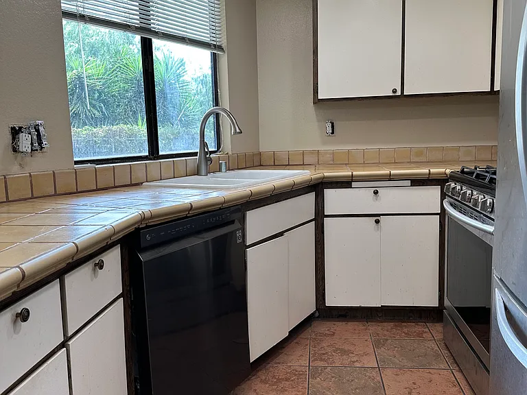 Kitchen has Backyard View