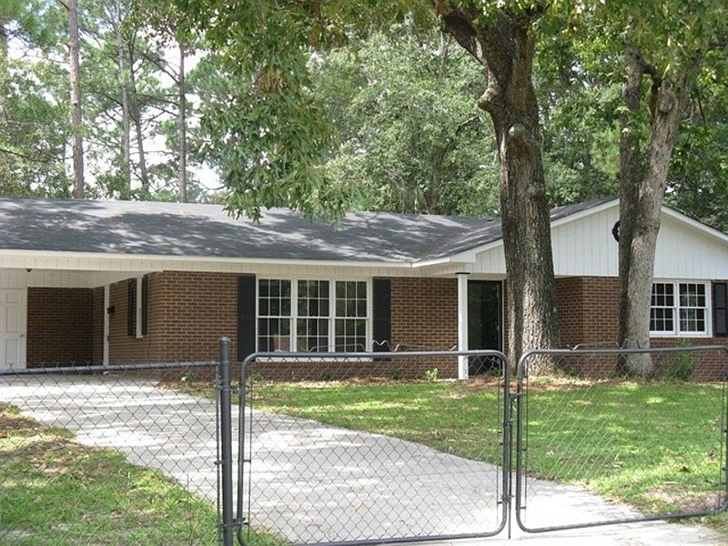 Front of house with fence