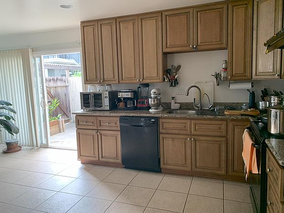 Kitchen counter area with entrance to side patio area