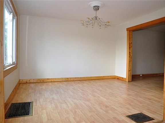 Light and bright dining room open to living room and kitchen