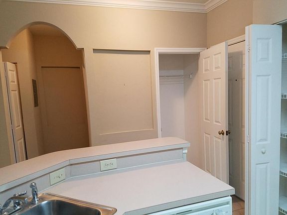 coat closet and hall way to bedroom