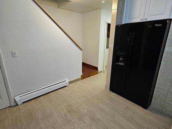 Kitchen leading up to bathroom and laundry room