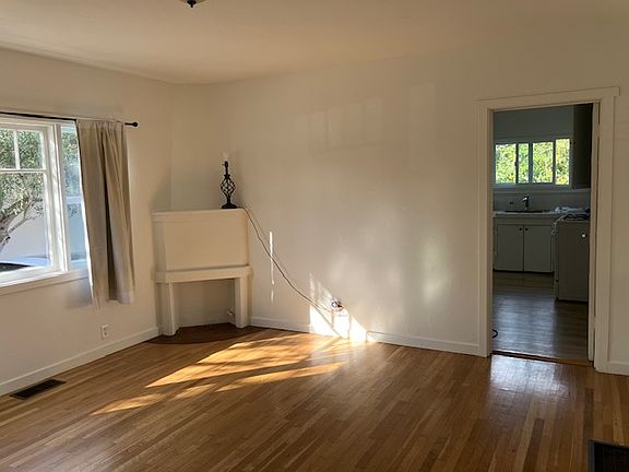 Living room looking toward kitchen ("fireplace" is non-operable, for decor only)