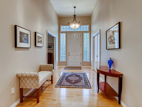 Entryway with high ceilings. 
(Though will be unfurnished when rented.)