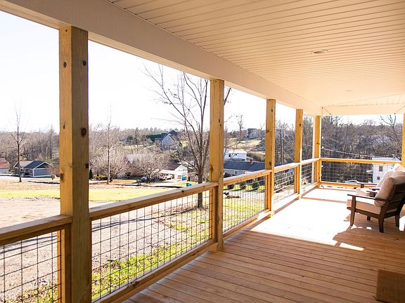 A wrap around porch allows this home to have extend space to spread out. Sighting of the Biltmore Estate can be seen right from the front porch!