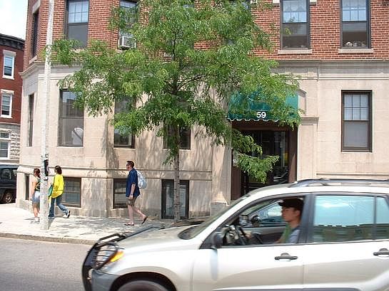 the unit on the left hand side above the three walking people on the street, is the unit.
