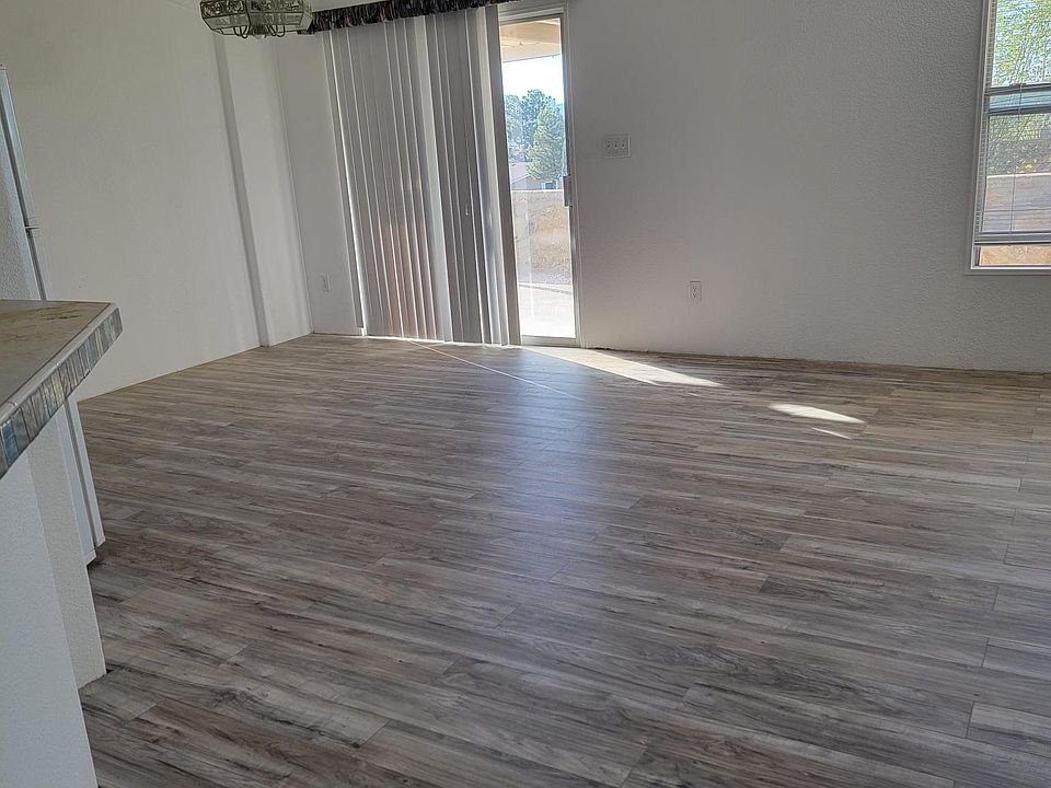 New vinyl plank flooring gives a warm updated look to the living area.