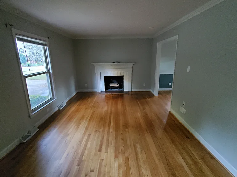 Living room with wood burning fire place.