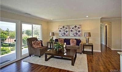 Living room with recessed lighting, central HVAC, wood floors an