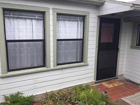 Living Room windows (there's another living room window facing another direction) / Front Door