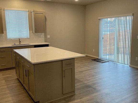 Kitchen eating area and glass slider to the fenced back yard.