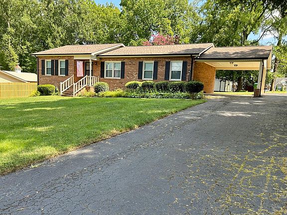 Front of home from right, driveway, carport