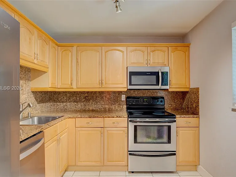 7910 Camino Real #N-105 — Photo 11