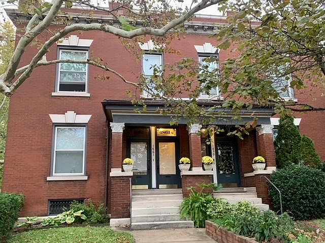 Well landscaped front entrance with covered porch. The available unit is the door and window on the left.