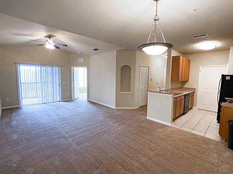 Open Concept Design with Lush Carpet in Living and Dining Rooms Open Concept Design with Lush Carpet in Living and Dining Rooms
