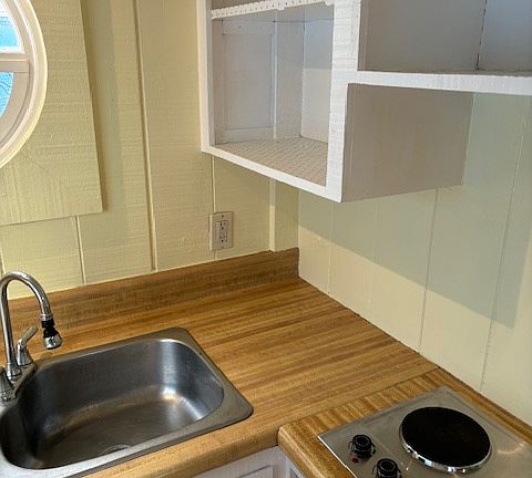 Storage above and below kitchen counter.