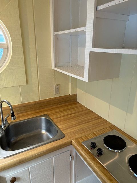 Storage above and below kitchen counter.