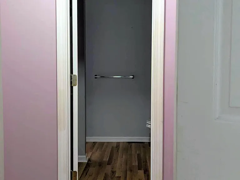 A separate walk-in closet connecting Bedroom 1 and the bathroom.