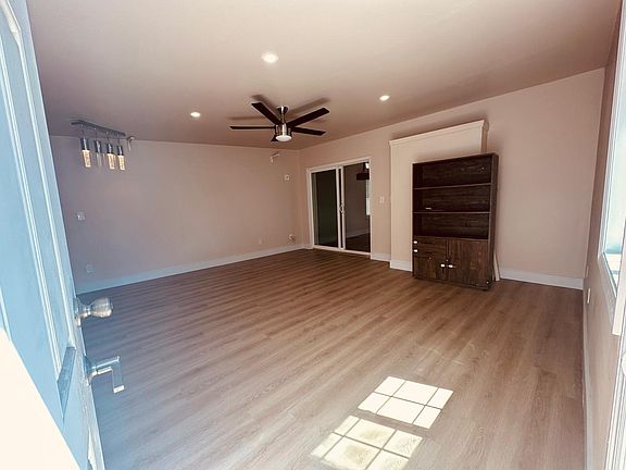 Private Family Room next to the kitchen with access to the backyard