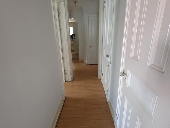 Hallway with multiple closets
