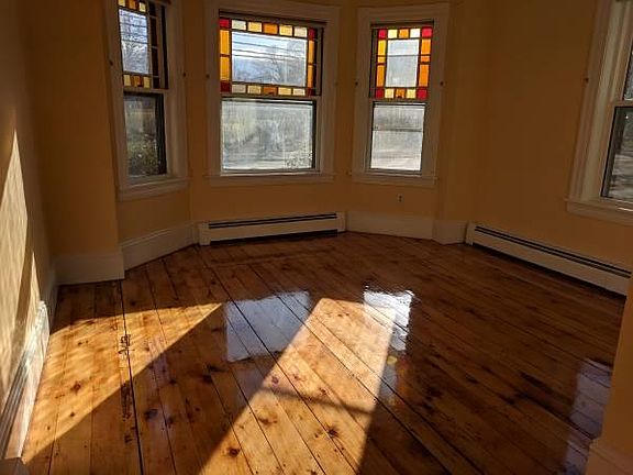 Living room with lots of natural light and stained glass. Closet and folding doors makes the layout of this apartment versatile, you could make this a bedroom if you fancy (not counted in bedroom count)